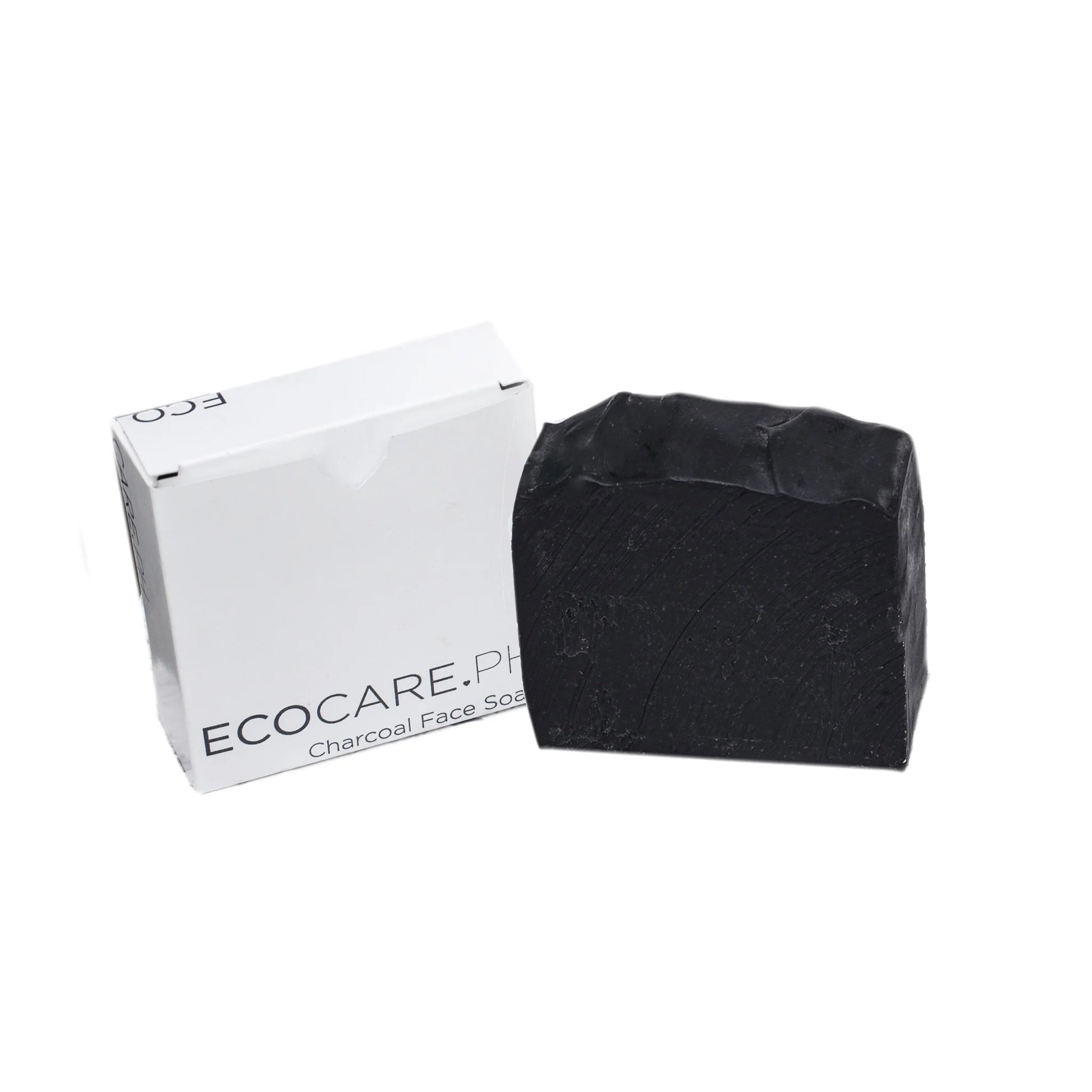 Charcoal soap bar in front of white EcoCare.PH box, both on white background